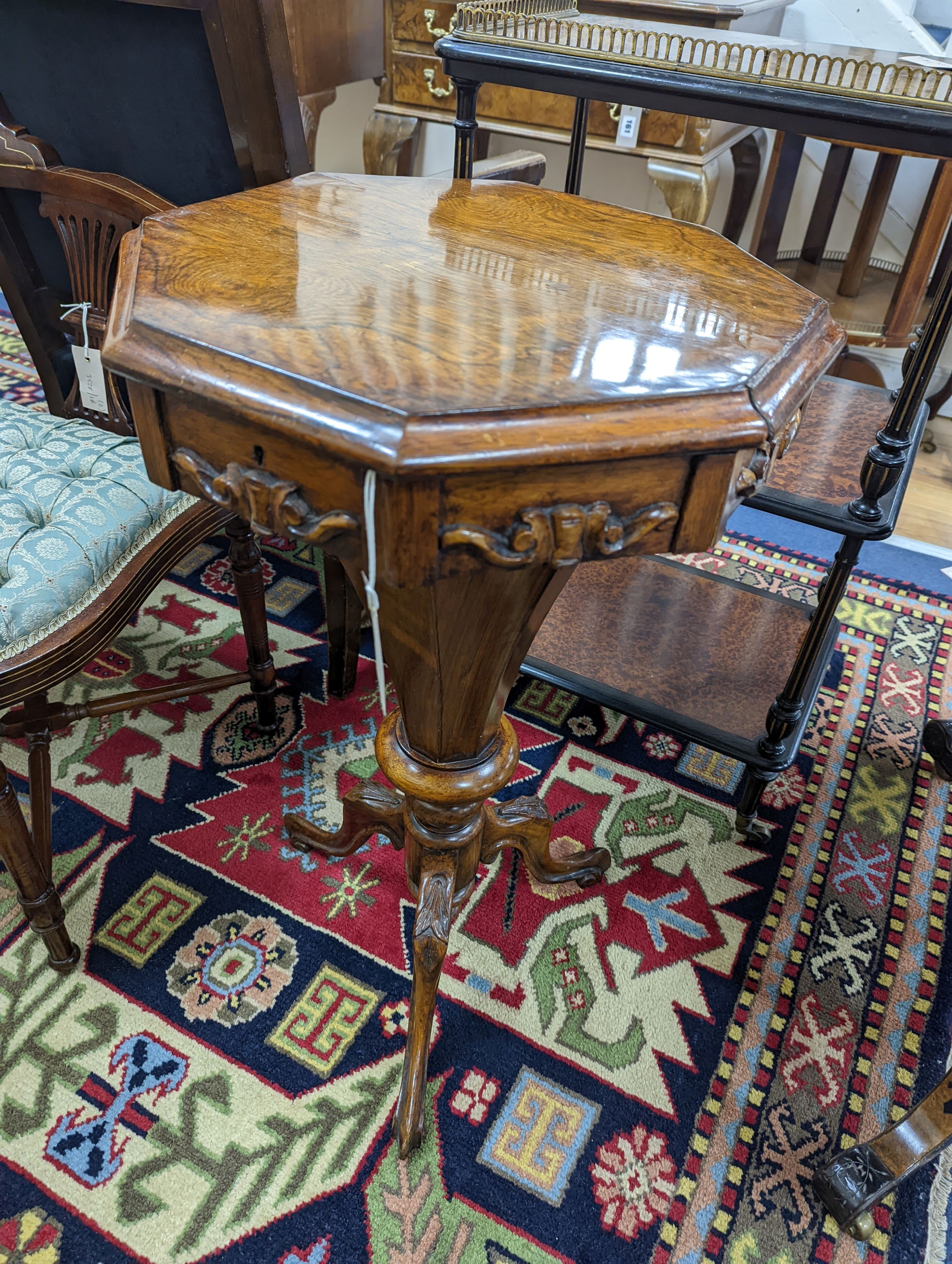 A Victorian octagonal walnut trumpet work table, width 42cm, height 73cm